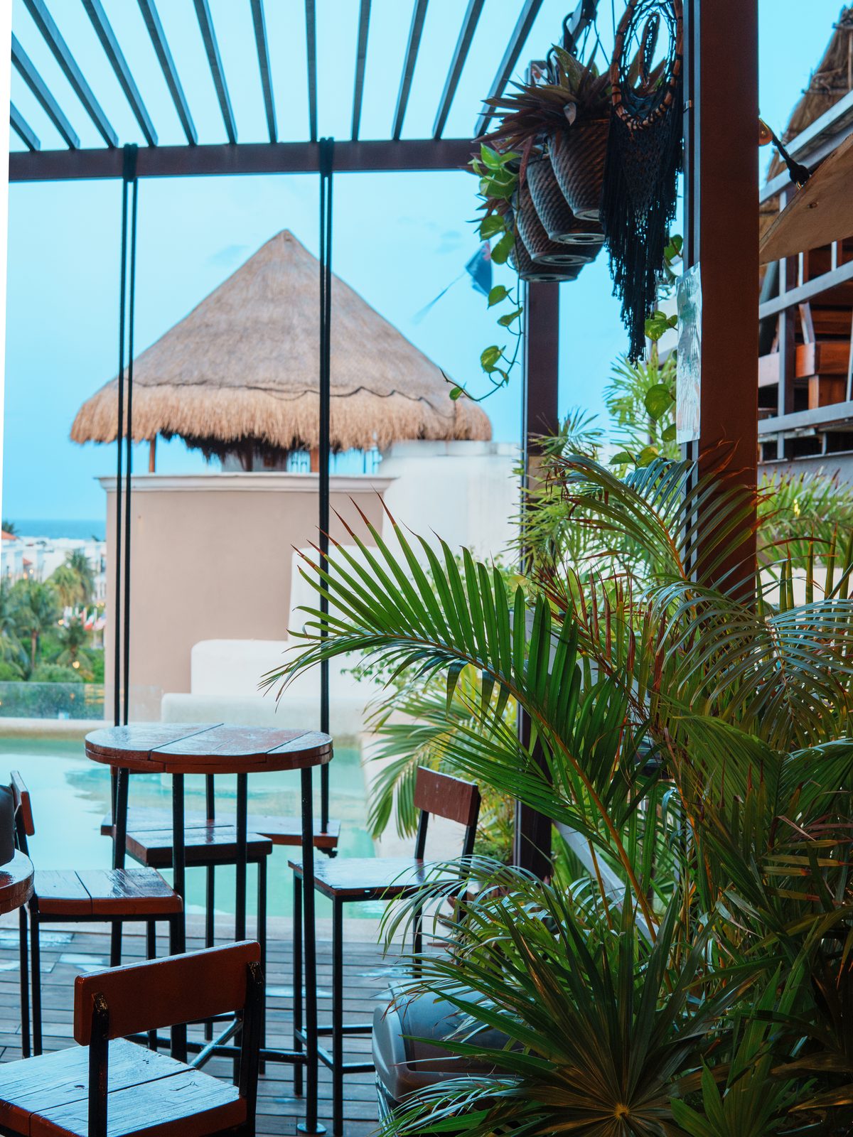 ‘Tropical State of Mind’ wall art at Maui Hostels Playa del Carmen rooftop
