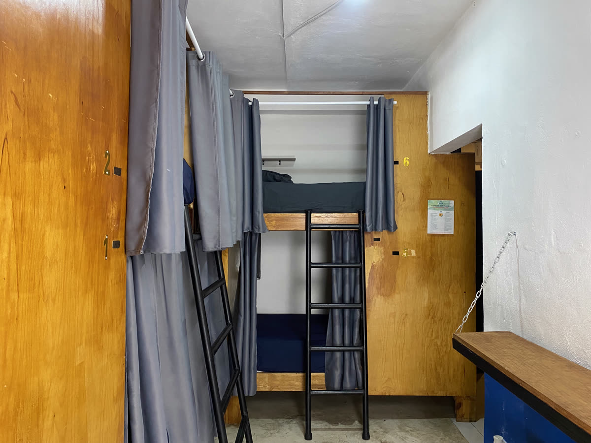 6-bed mixed dorm room at Maui Hostels Tulum – bunk beds with lockers