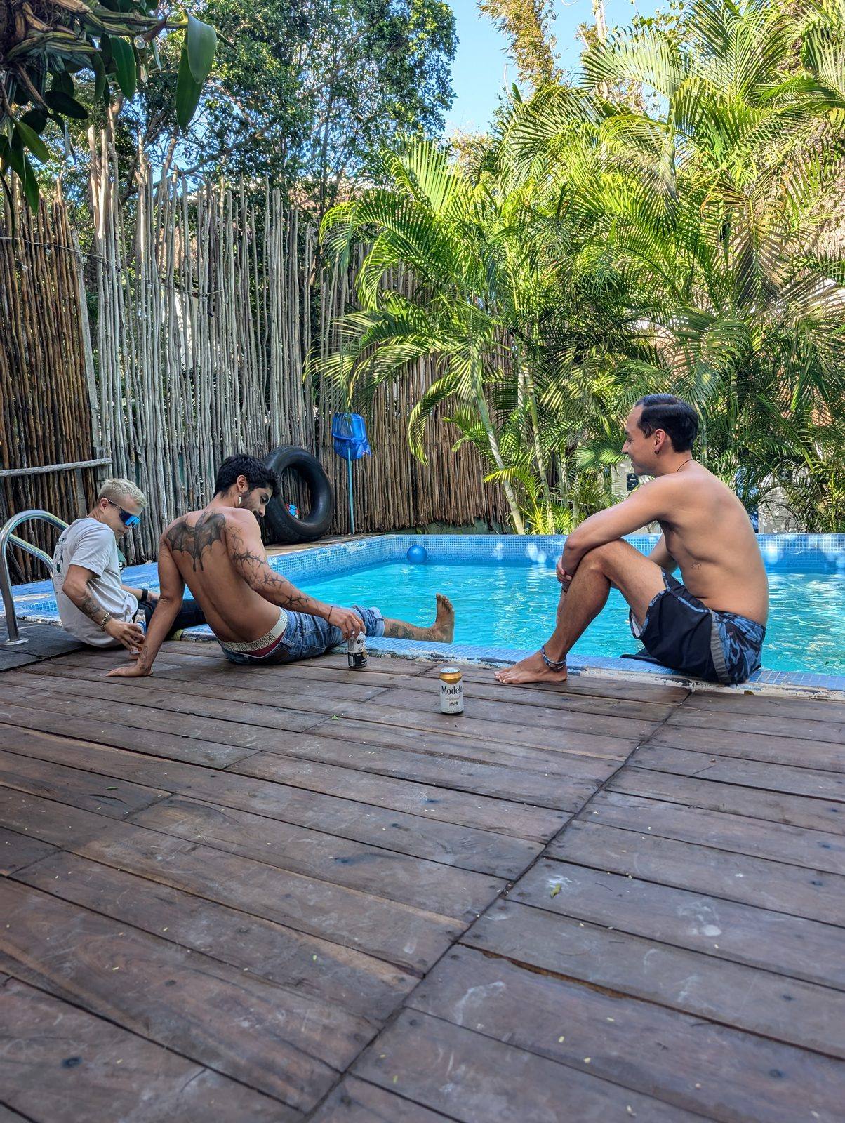 Pool with papalote and palms at Maui Hostels Tulum jungle hostel