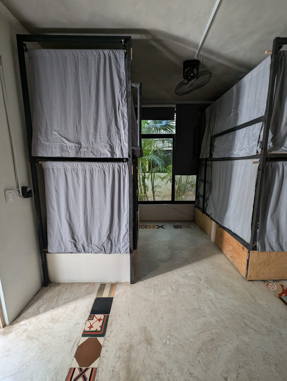 6-bed mixed dorm with curtained bunks at Maui Hostels Tulum