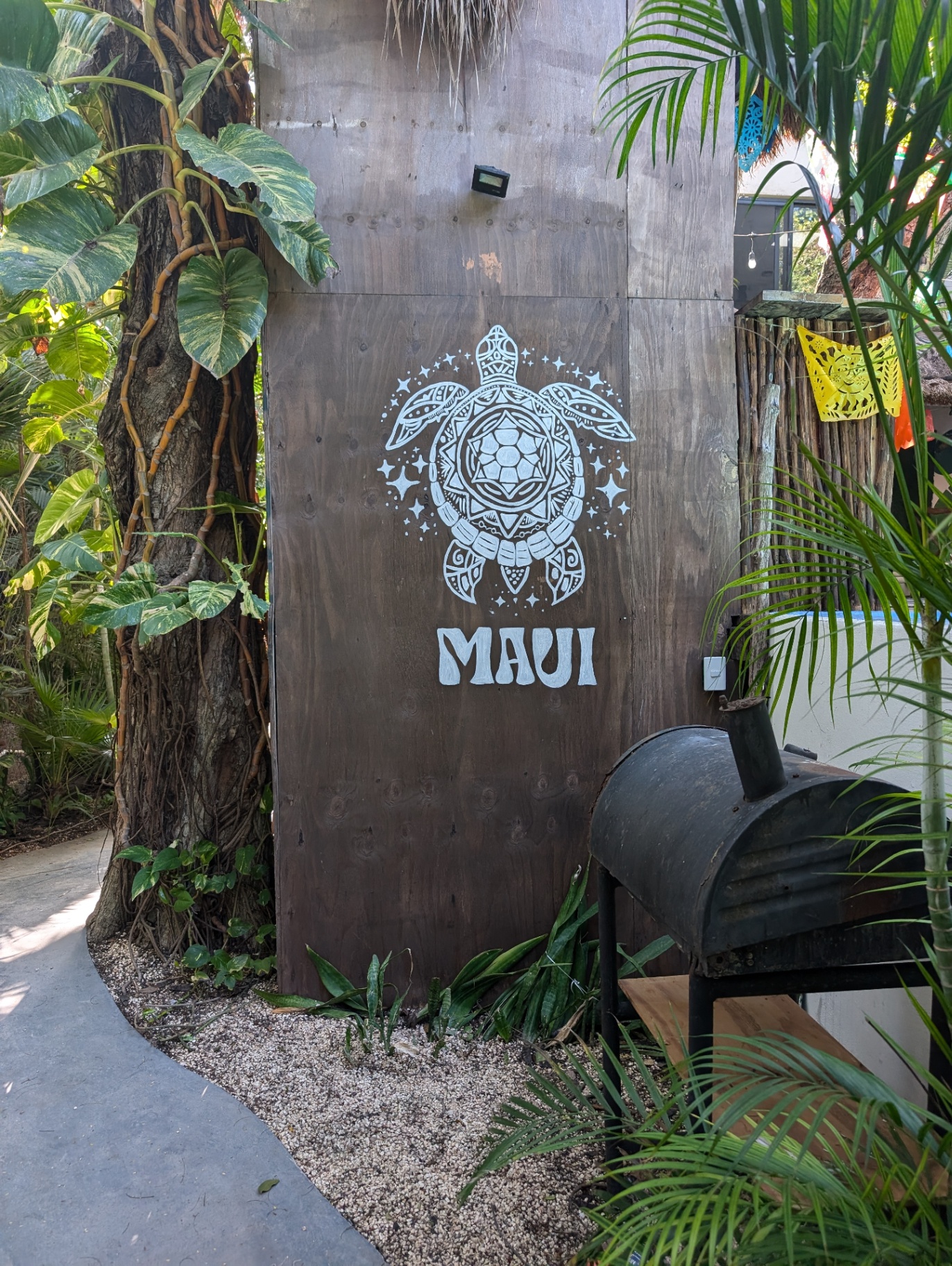 Maui Hostels turtle logo mural at Tulum hostel entrance